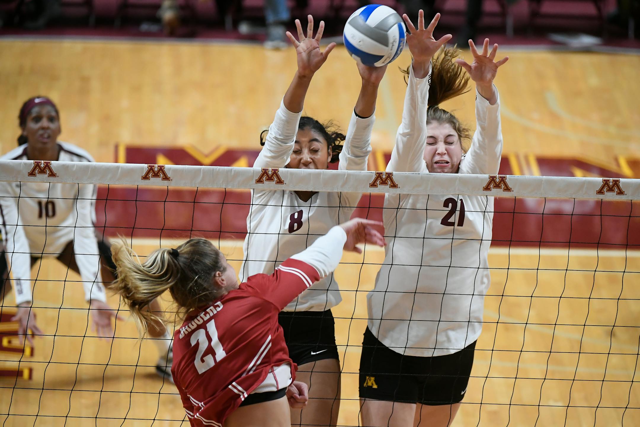 Gophers outside hitter Airi Miyabe (8) and middle blocker Regan Pittman (21) went up for a block attempt against Wisconsin. Miyabe left her native Japan to test herself in many ways, not just on the volleyball court.
