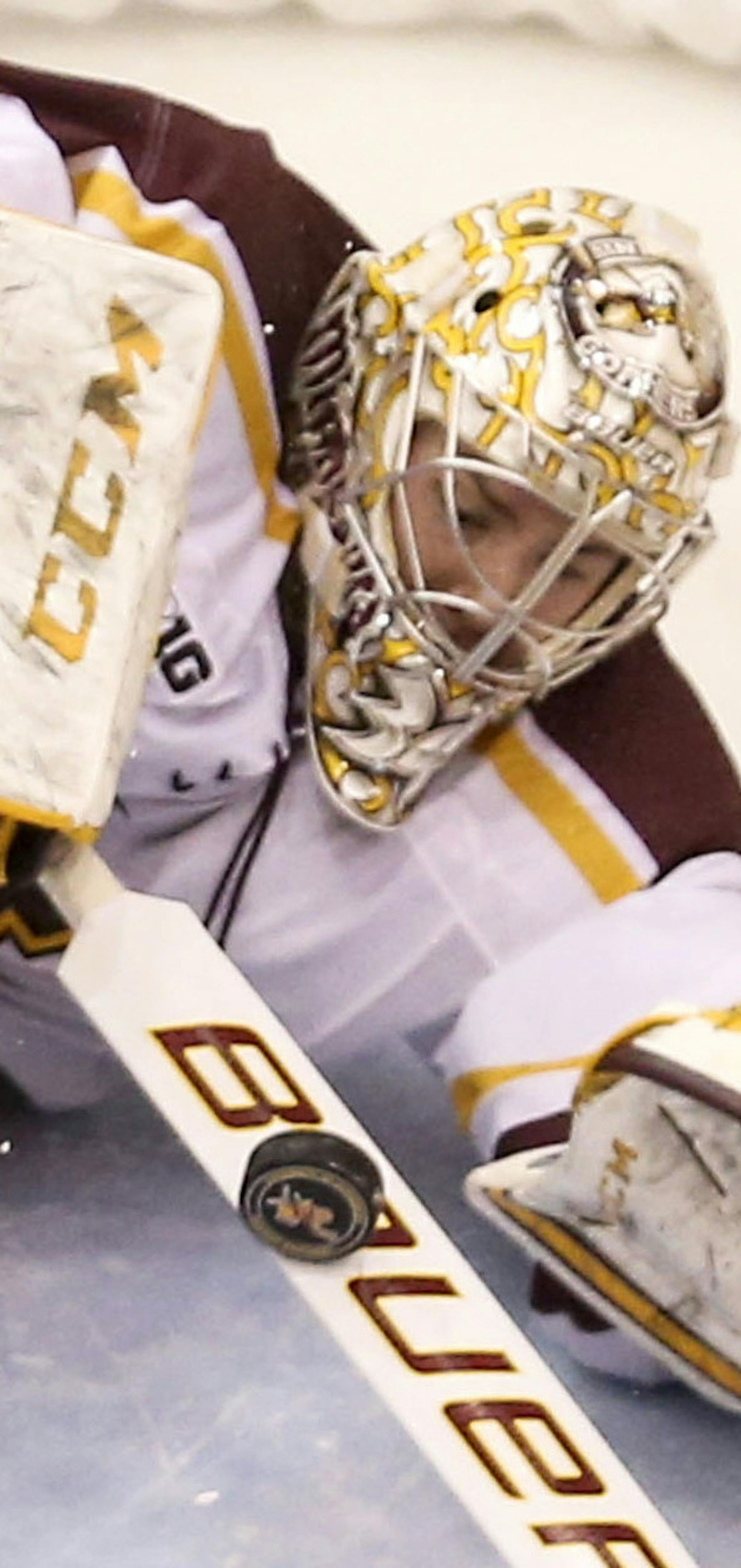 University of Minnesota Gophers goalie Nik Lehr (34) makes a stop on a shot by US U-18's Matthew Tkachuk (7) during first period action of their exhibition game Friday, Nov. 21, 2014, at Mariucci Arena on the University of Minnesota Campus in Minneapolis, MN..](DAVID JOLES/STARTRIBUNE)djoles@startribune Gophers men's hockey game, vs US U-18 team, exhibition game ORG XMIT: MIN1411211954125935