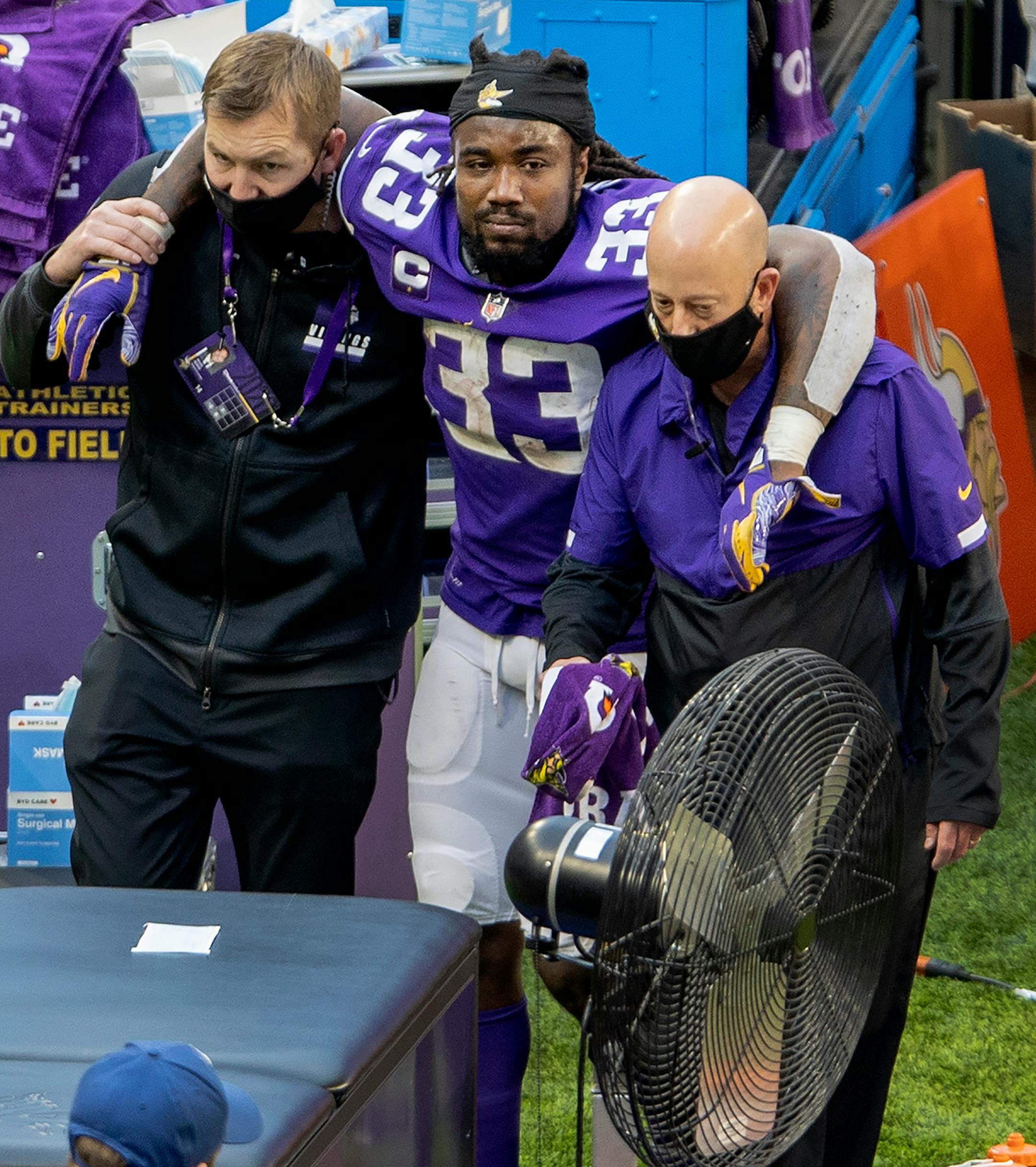 Minnesota Vikings running back Dalvin Cook (33) was helped off the field and to the trainers table in the third quarter