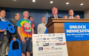 Bruce Nustad, president of the Minnesota Retailers Association, speaks at a press conference calling for the repeal of tight lead limits in keys at th