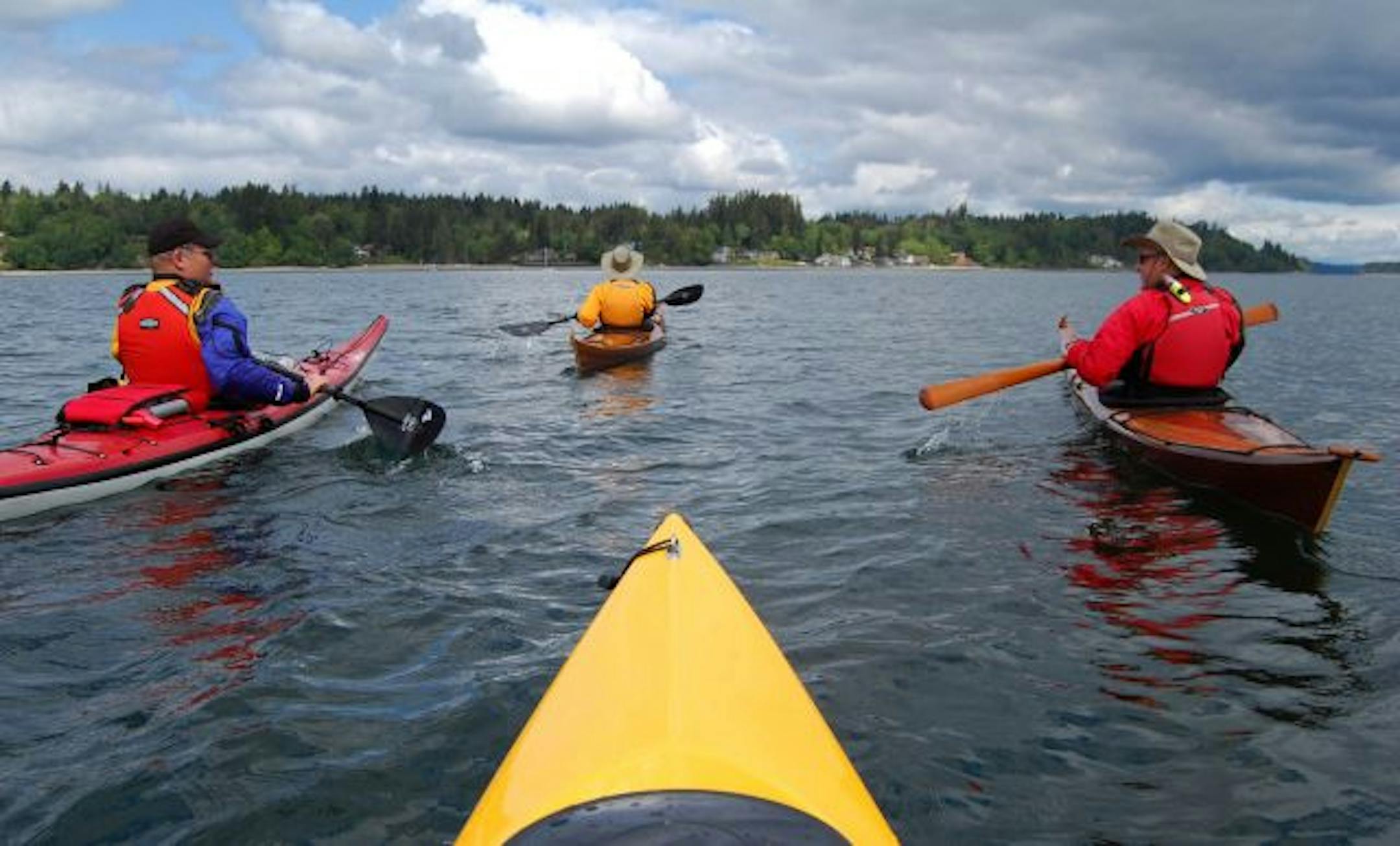 South Sound Area Kayakers Club members Gerry Hodge, left, Holly Henry and Ted Henry paddle together during a trip from Boston Harbor to Hope Island State Park in Washington.