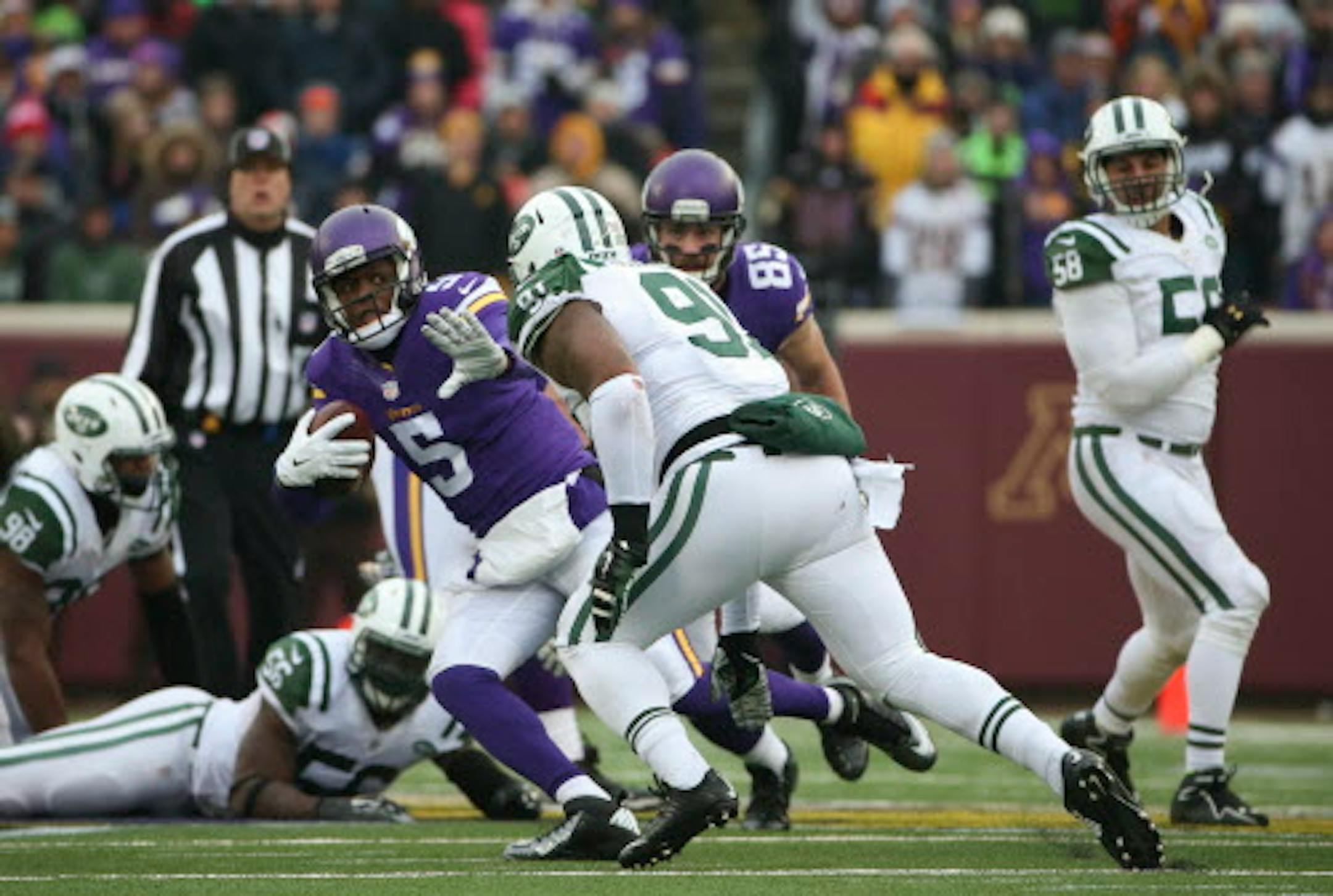 Minnesota Vikings quarterback Teddy Bridgewater (5) was sacked for a three yard loss by New York Jets defensive end Sheldon Richardson (91) in the fourth quarter Sunday afternoon.   ]  JEFF WHEELER • jeff.wheeler@startribune.com    The Minnesota Vikings beat the New York Jets 30-24 in overtime in an NFL football game Sunday afternoon, December 7, 2014 at TCF Bank Stadium in Minneapolis.