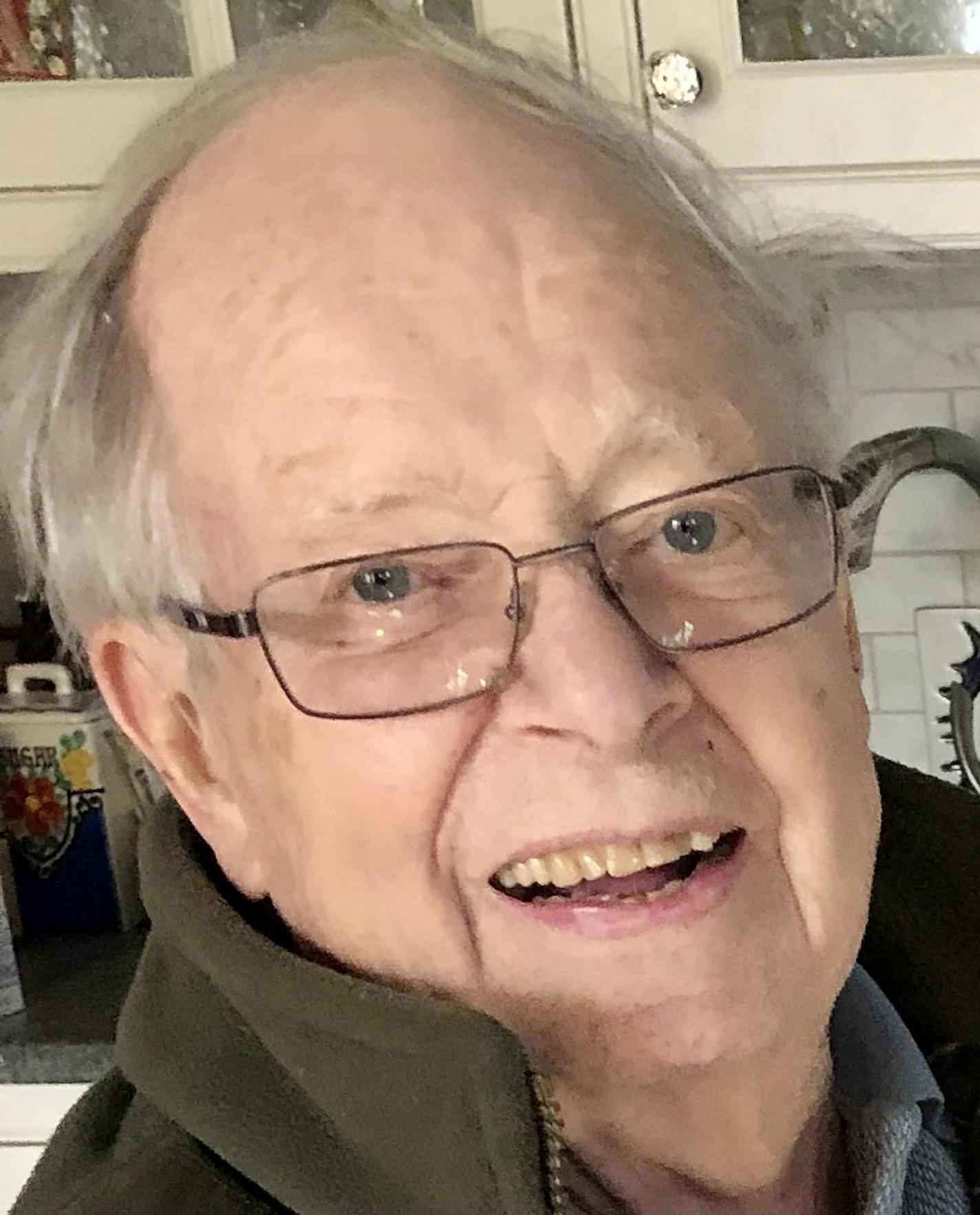 John Tester with his groundbreaking book on Minnesota ecology.