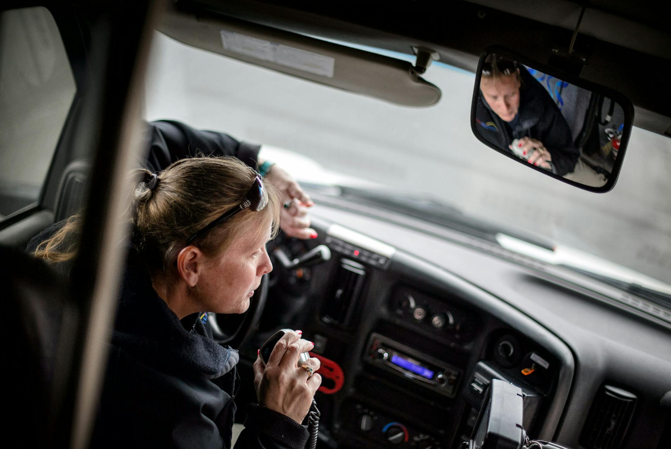 SmartLink driver Betty Leonhardt radioed to her dispatch center when a passenger with an appointment didn't come out to the bus. ] GLEN STUBBE * gstubbe@startribune.com Thursday, March 19, 2015 SmartLink drivers are facing massive layoffs this year -- every single driver, plus some additional staff -- as the result of a funding cut to the county program. Drivers are worried about what'll happen to their passengers, many of whom have mental and/or physical disabilities and have come to know and r