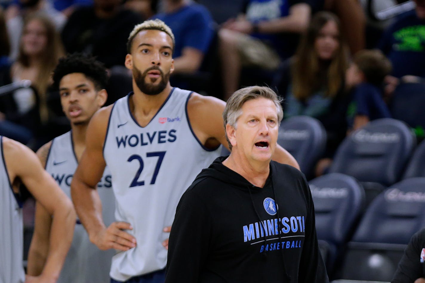 Minnesota Timberwolves coach Chris Finch directs practice alongside new center Rudy Gobert.