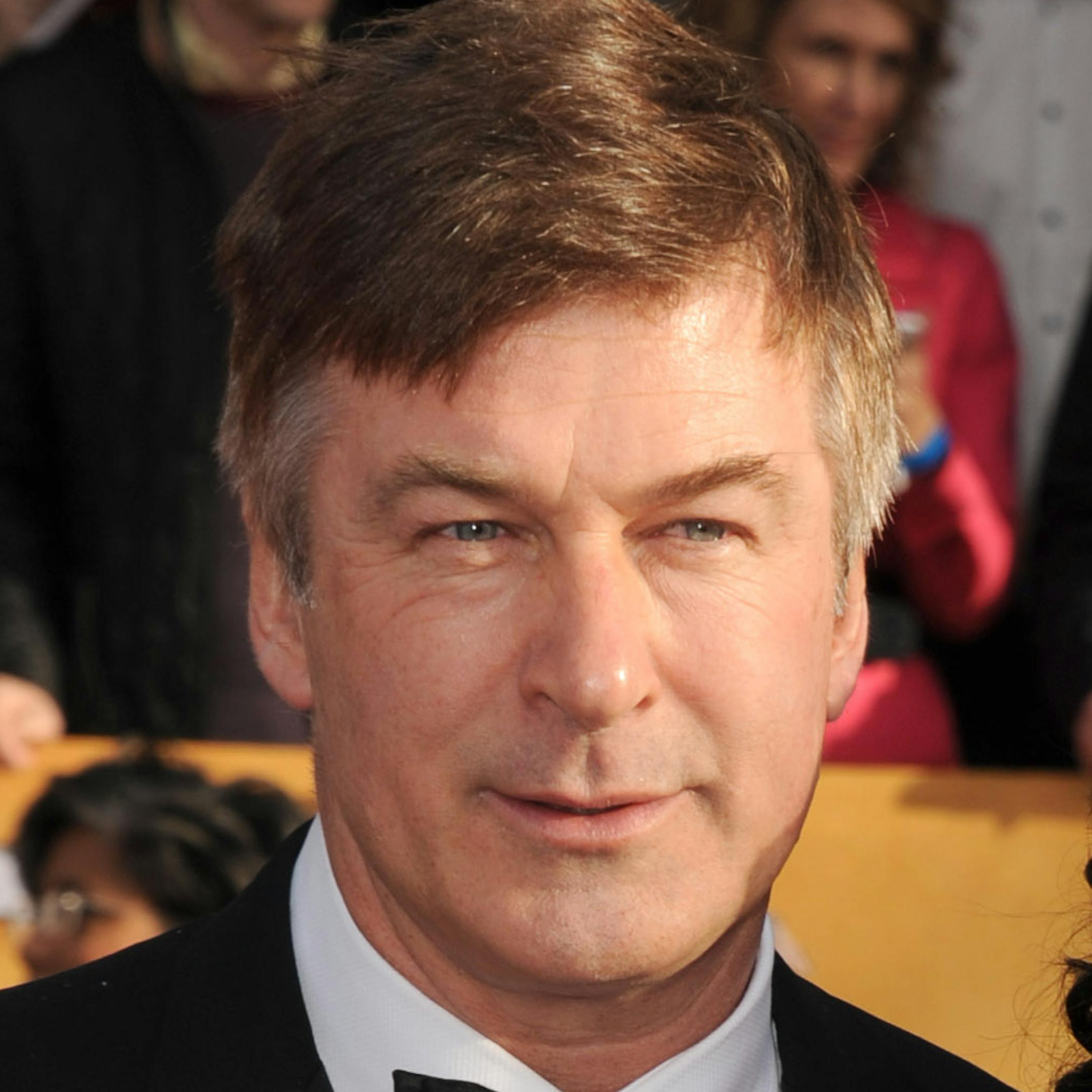 FILE - In this Jan. 27, 2013 file photo, Alec Baldwin, left, and Hilaria Thomas arrive at the 19th Annual Screen Actors Guild Awards at the Shrine Auditorium in Los Angeles. Baldwin is expected to testify Tuesday, Nov. 12, 2013, in Genevieve Sabourinís (ZHAHN'-vee-ehv sah-boor-EHN') trial in New York City. Prosecutors say she bombarded the actor with messages professing her love and showed up uninvited at his New York and Hamptons homes in 2012. (Photo by Jordan Strauss/Invision/AP, File)