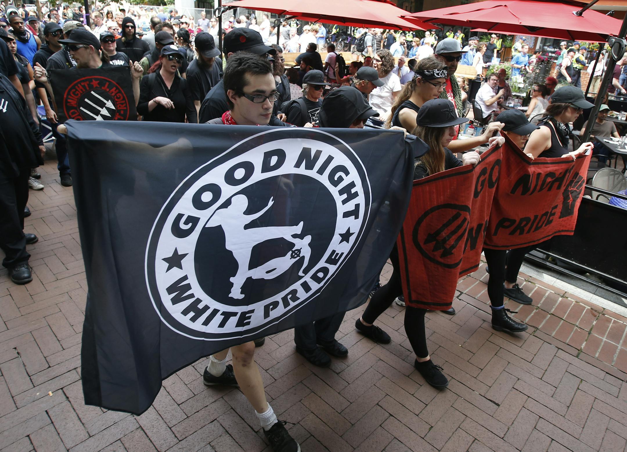 A group anti-fascism demonstrators march in the downtown area in anticipation of the anniversary of last year's Unite the Right rally in Charlottesville, Va., Saturday, Aug. 11, 2018. (AP Photo/Steve Helber)
