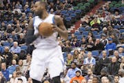 Seats are about half full behind Minnesota Timberwolves forward Shabazz Muhammad (15) as he pulls down the ball during a game against the Phoenix Suns