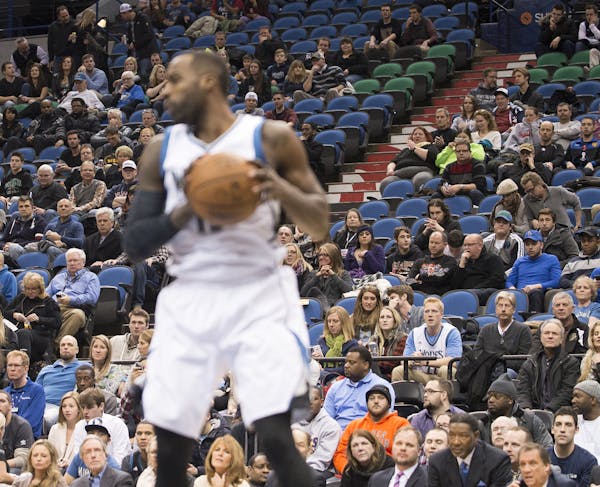 Seats are about half full behind Minnesota Timberwolves forward Shabazz Muhammad (15) as he pulls down the ball during a game against the Phoenix Suns