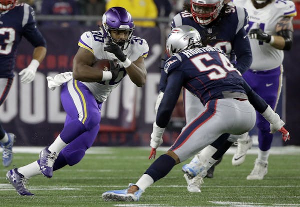 New England Patriots linebacker Dont'a Hightower (54) pursues Minnesota Vikings fullback C.J. Ham (30) during the first half of an NFL football game, 