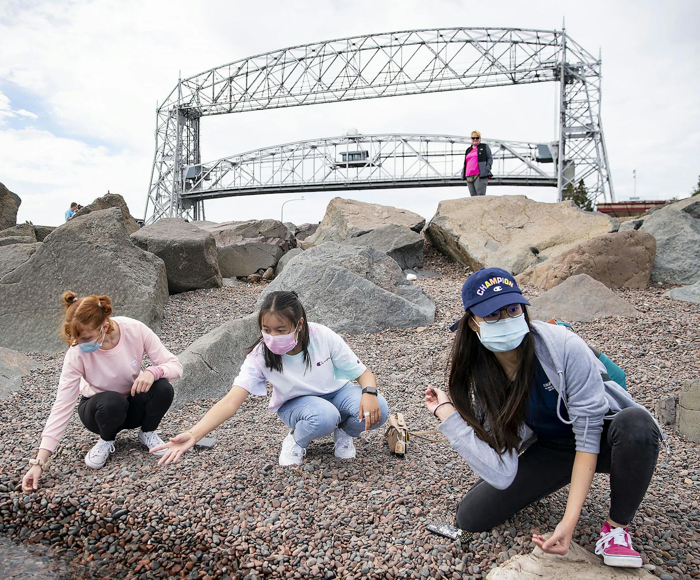 (From left) Hannah Egge, Sirivisa Vichiensan and Yoyo Lau skipped rocks on Lake Superior in Canal Park in Duluth on Friday afternoon. All three girls attend the University of Wisconsin with Vichiensan and Lau being foreign exchange students from Thailand and Hong Kong, respectively. ] ALEX KORMANN • alex.kormann@startribune.com Though a surge of visitors came to Duluth after July 4, the city's tourism tax collections for that month were still a quarter less than the $1.4 million expected. Hundre