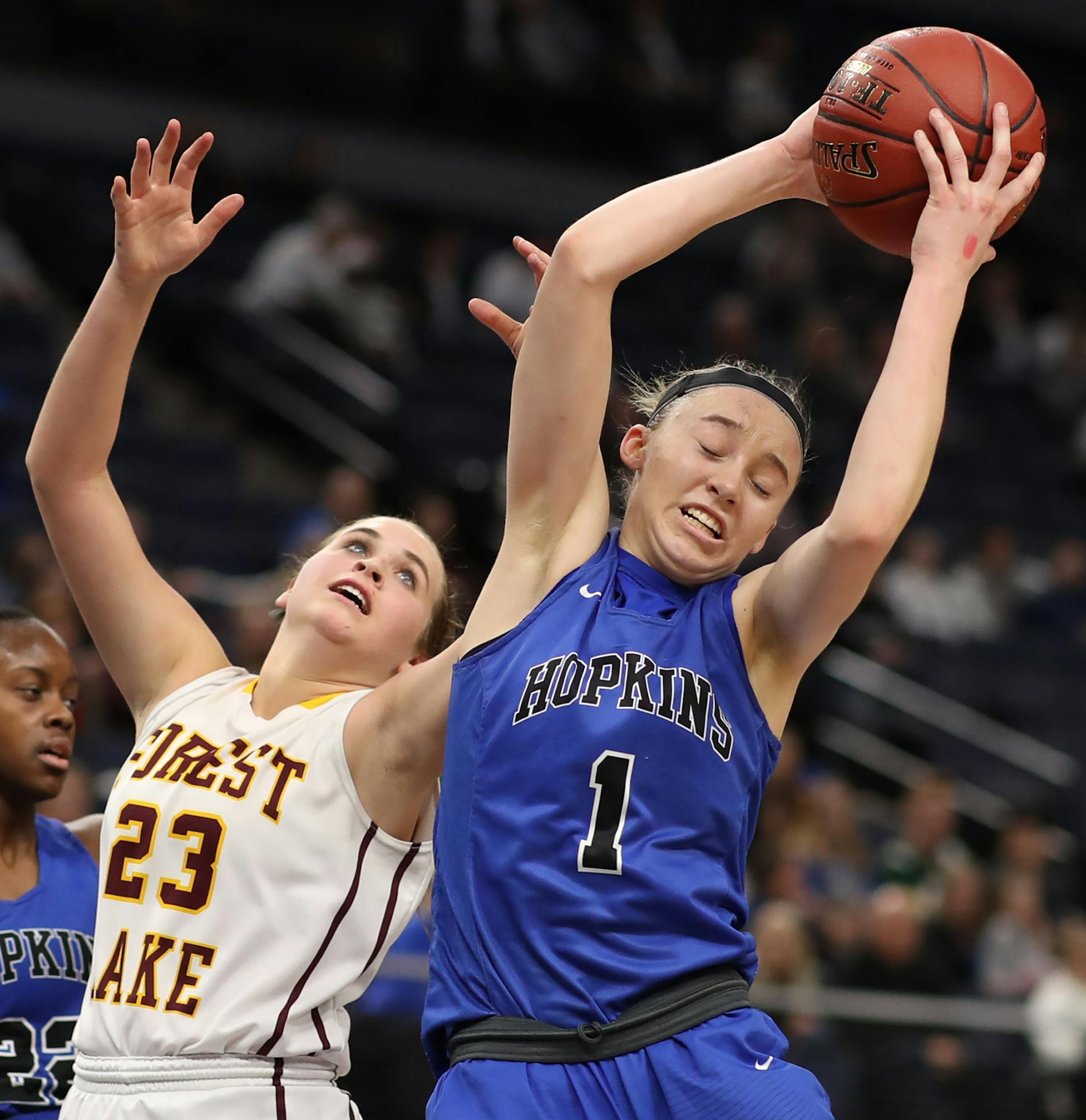 Paige Bueckers of Hopkins rebounded over Grace VanBergen of Forest Lake during girls class 4A quarter final action at Target Center Wednesday March 14, 2018 in Minneapolis, MN.] Hopkins played Forest Lake at Target Center . JERRY HOLT ï jerry.holt@startribune.com