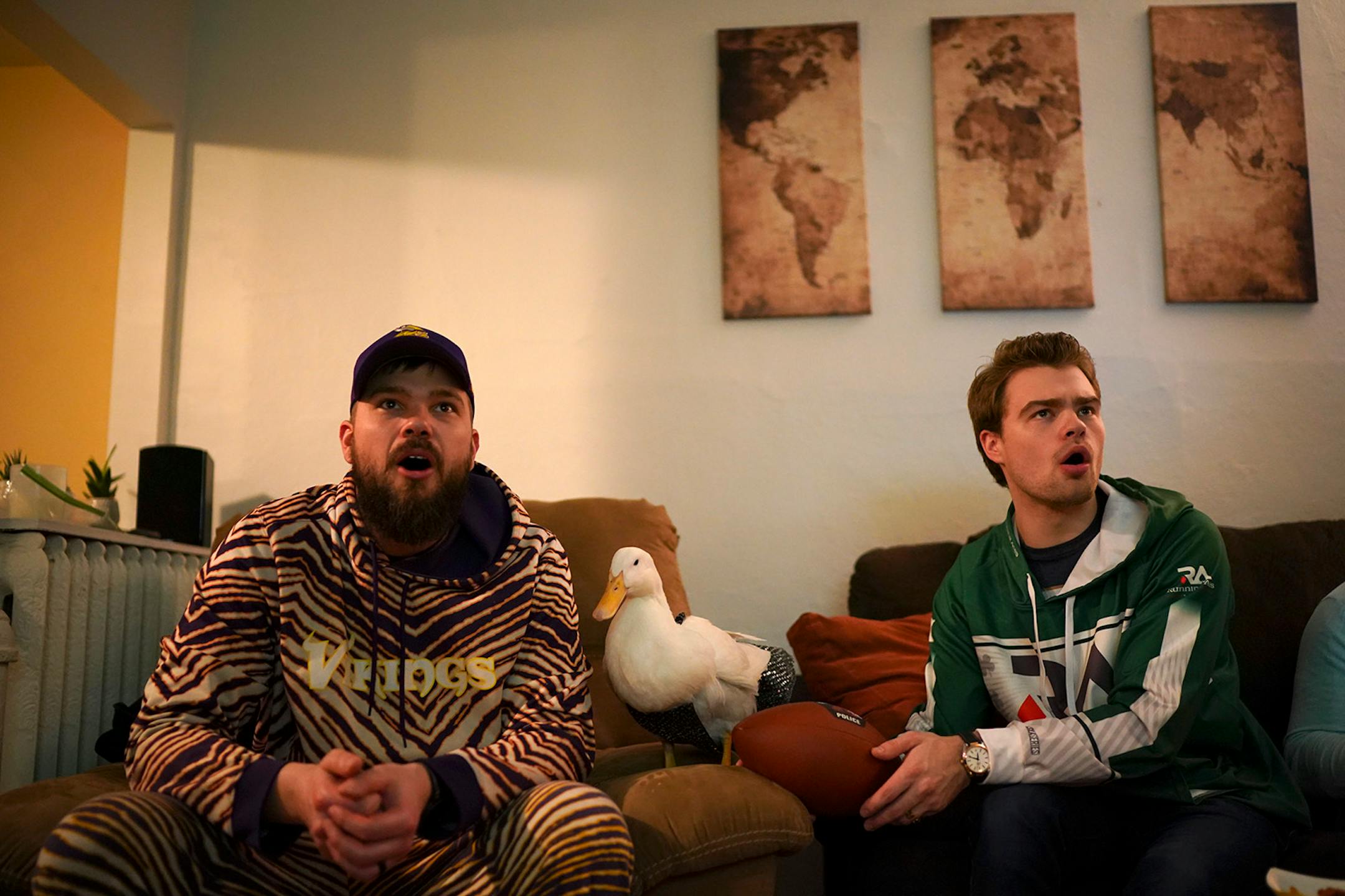 Ben Afquack stayed close to his owner, Derek Johnson, while watching the Super Bowl with friends, including Corey Bahr Sunday night.