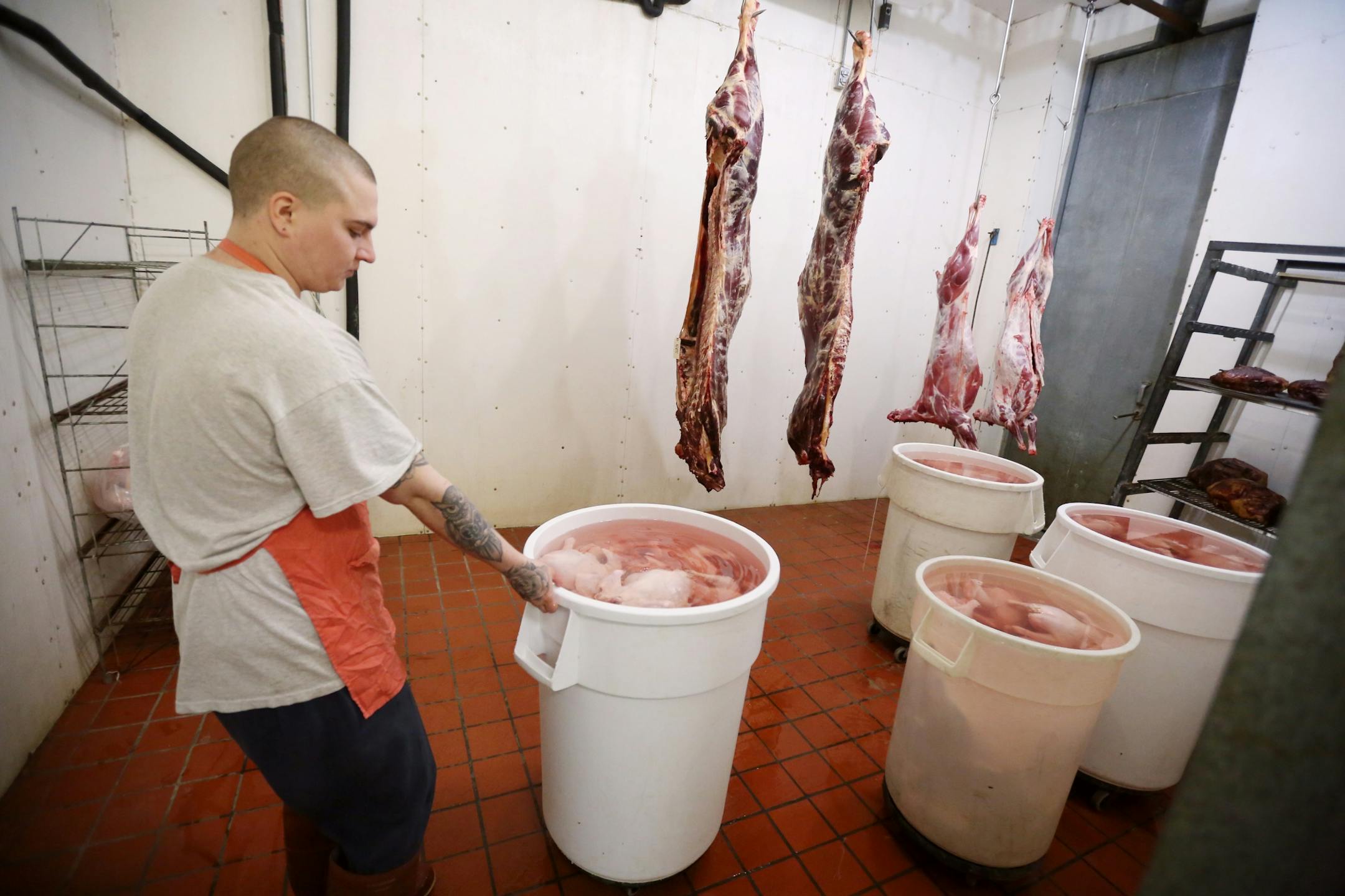 Zach Malich an inmate at the Northeast Regional Corrections Center gathered chickens from the freezer to be butchered. . Inmates at the Northeast Regional Corrections Center butcher chickens and pigs mostly to eat later in the week for lunch. A few lawmakers want to turn that loose program into a certification-granting curriculum with the idea that it will help the men get jobs and, more broadly, respond to a shortage of butchers.