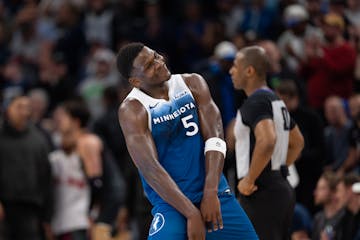 Timberwolves guard Anthony Edwards happily heads to the bench after scoring a career-high 51 points in the Wolves' 130-121 victory over the Wizards at