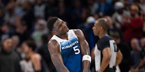 Timberwolves guard Anthony Edwards happily heads to the bench after scoring a career-high 51 points in the Wolves' 130-121 victory over the Wizards at