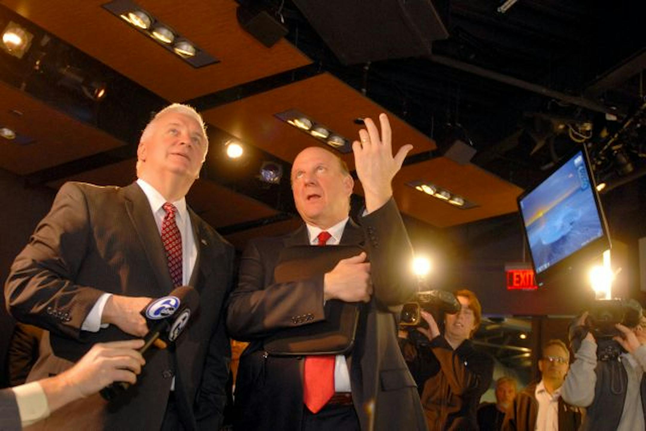 Microsoft CEO Steve Ballmer, right, and Pennsylvania Gov. Tom Corbett watched a demonstration on monitors of cloud applications at the new Microsoft Technology Center in Malvern, Pa.