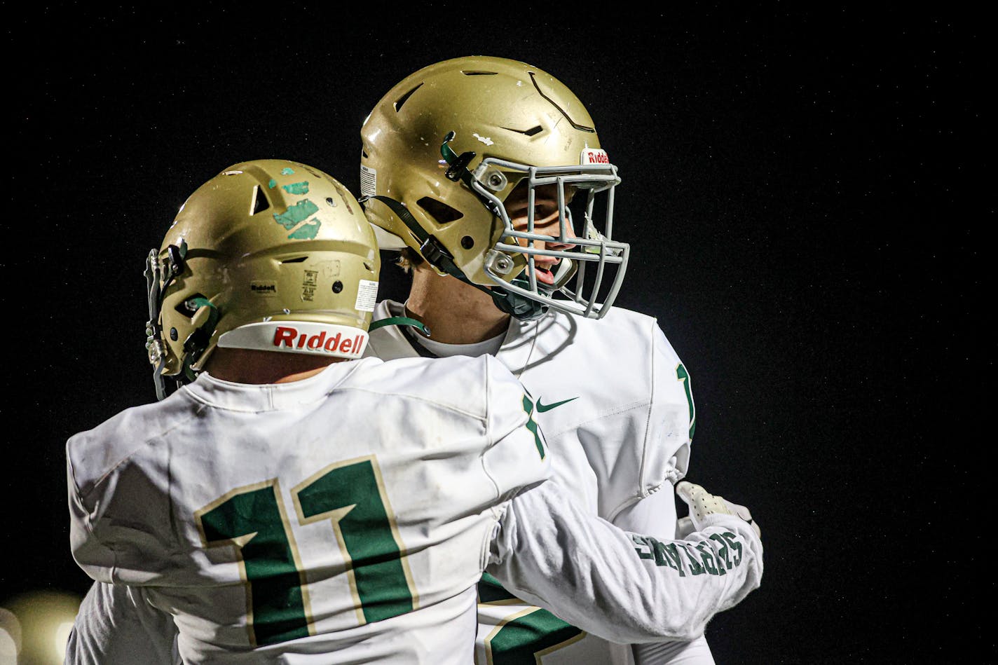 Rochester Mayo receiver Carter Holcomb (11) and quarterback Rees Grimsrud greet each other and connecting for a second-quarter touchdown pass. Mayo led New Prague 21-7 at the half. Photo by Mark Hvidsten, SportsEngine