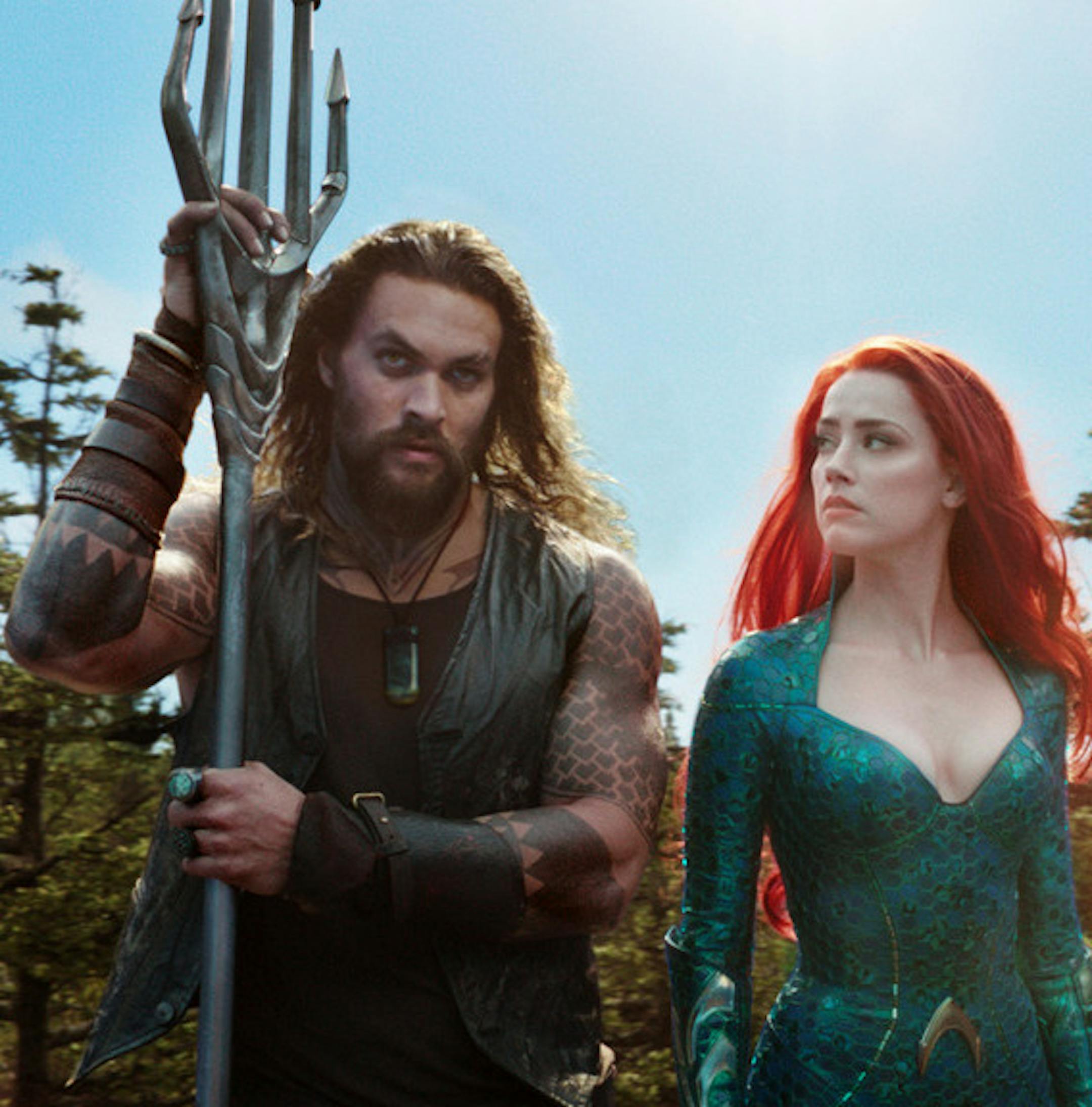 This image released by Warner Bros. Pictures shows Jason Momoa, left, and Amber Heard in a scene from "Aquaman." (Warner Bros. Pictures via AP)