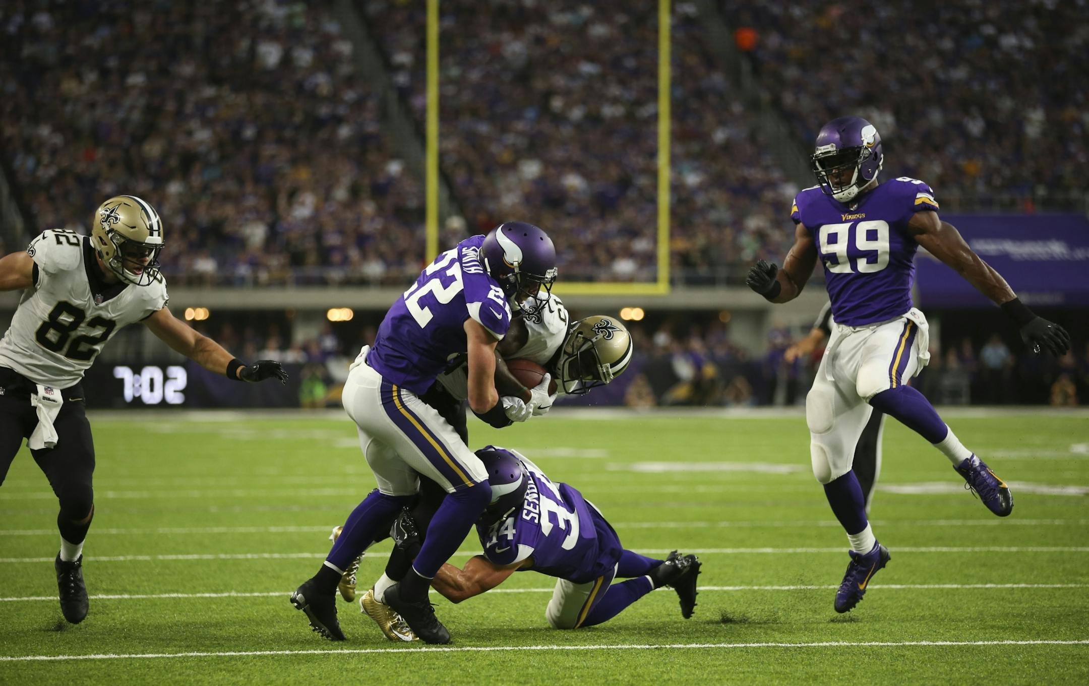 New Orleans Saints wide receiver Ted Ginn (19) was tackled by Minnesota Vikings free safety Harrison Smith (22) short of the goal line in the second quarter.