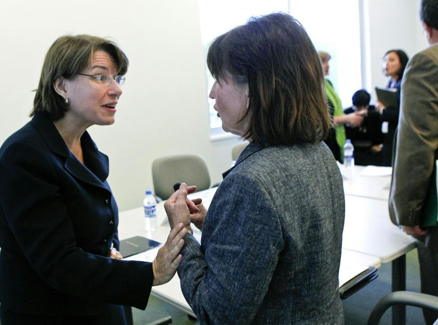 U.S. Sen. Amy Klobuchar talked with Deanna Van de North after Van de North addressed a discussion group Wednesday on shortcomings in the guardianship system, and how they affected her dying mother. Klobuchar has introduced legislation to address such shortcomings nationally.