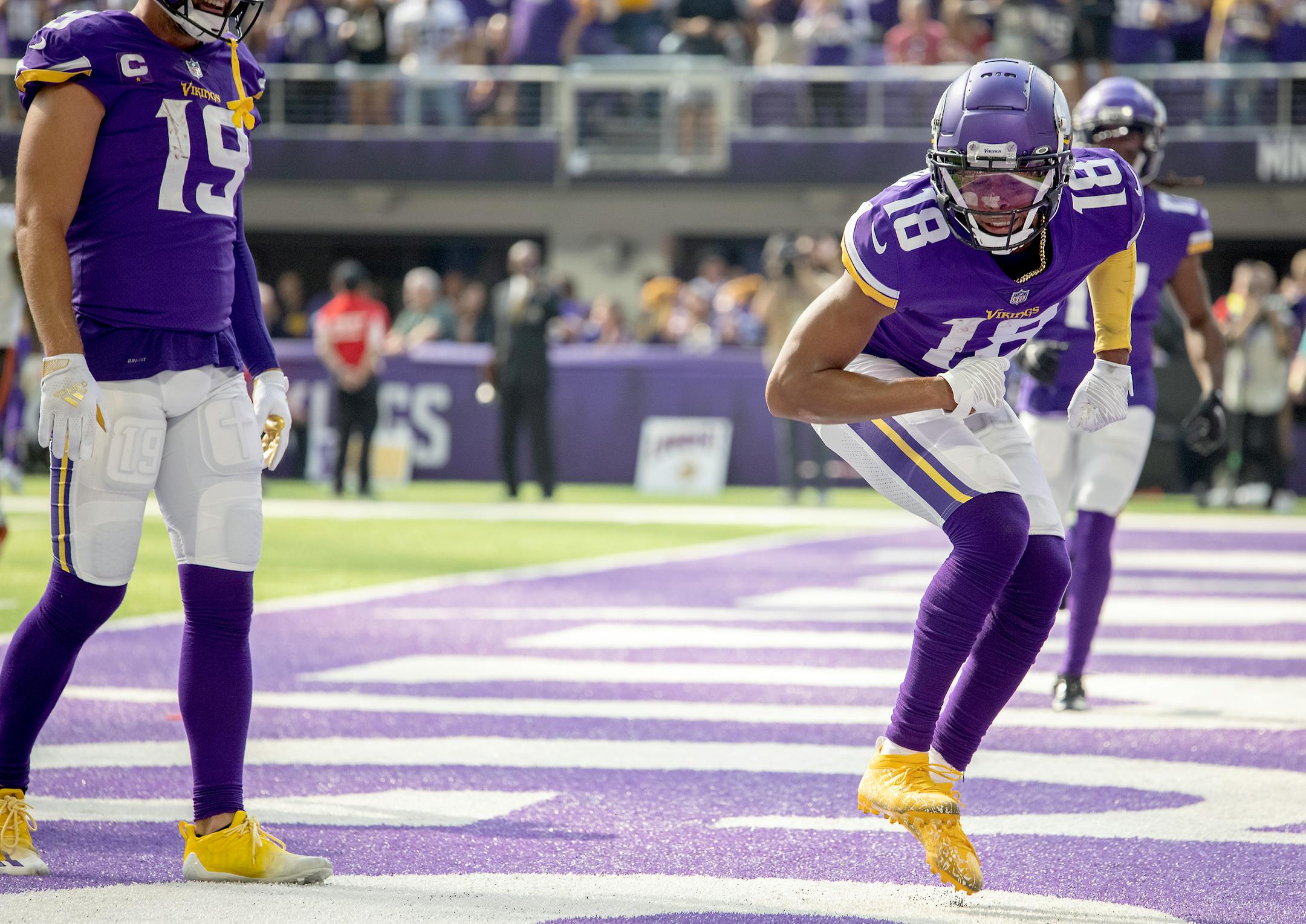 Vikings wide receiver Justin Jefferson (18) celebrated in the end zone after his touchdown in the first quarter.