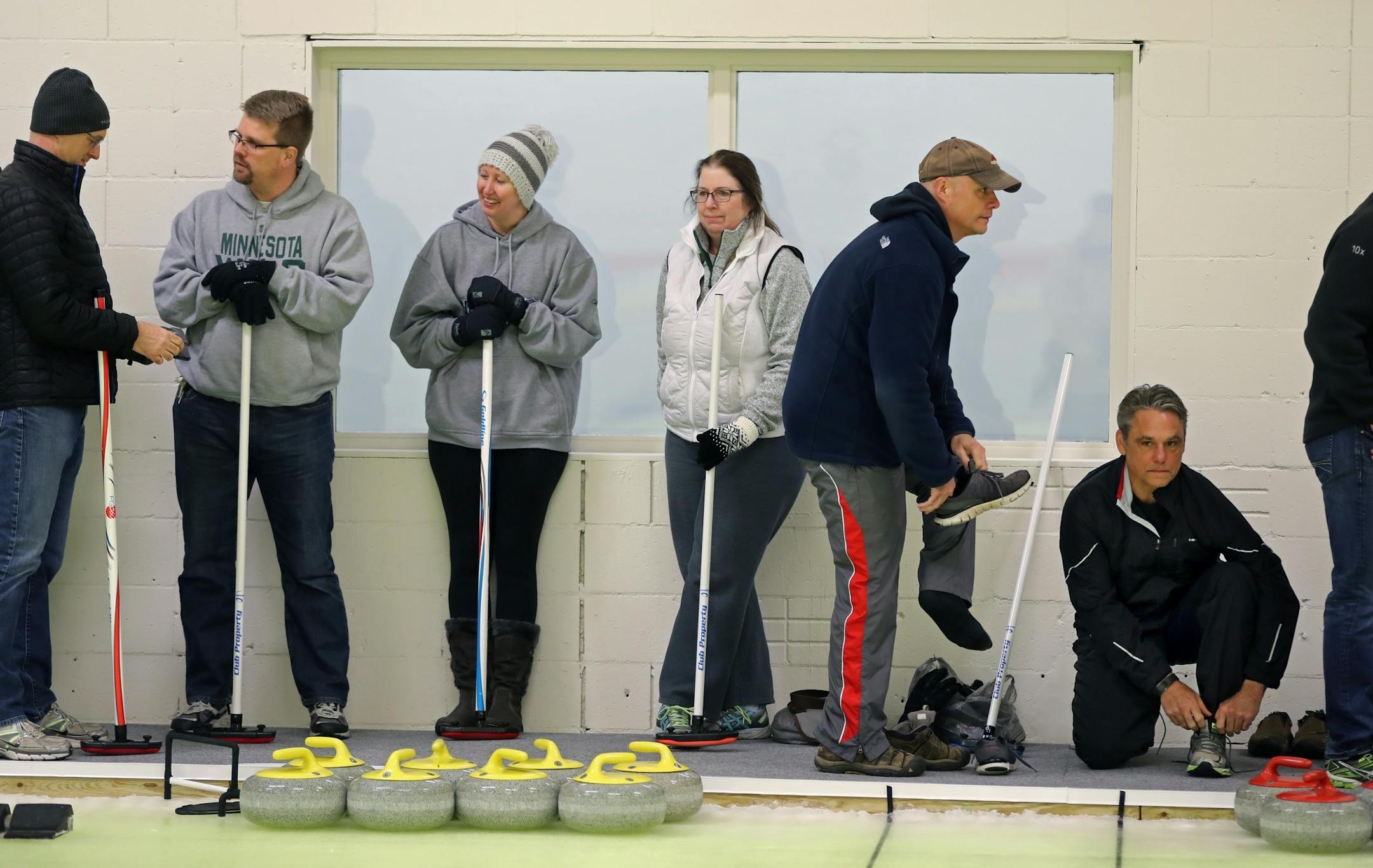 Several dozen people turned out for lessons and to experience how to curl.