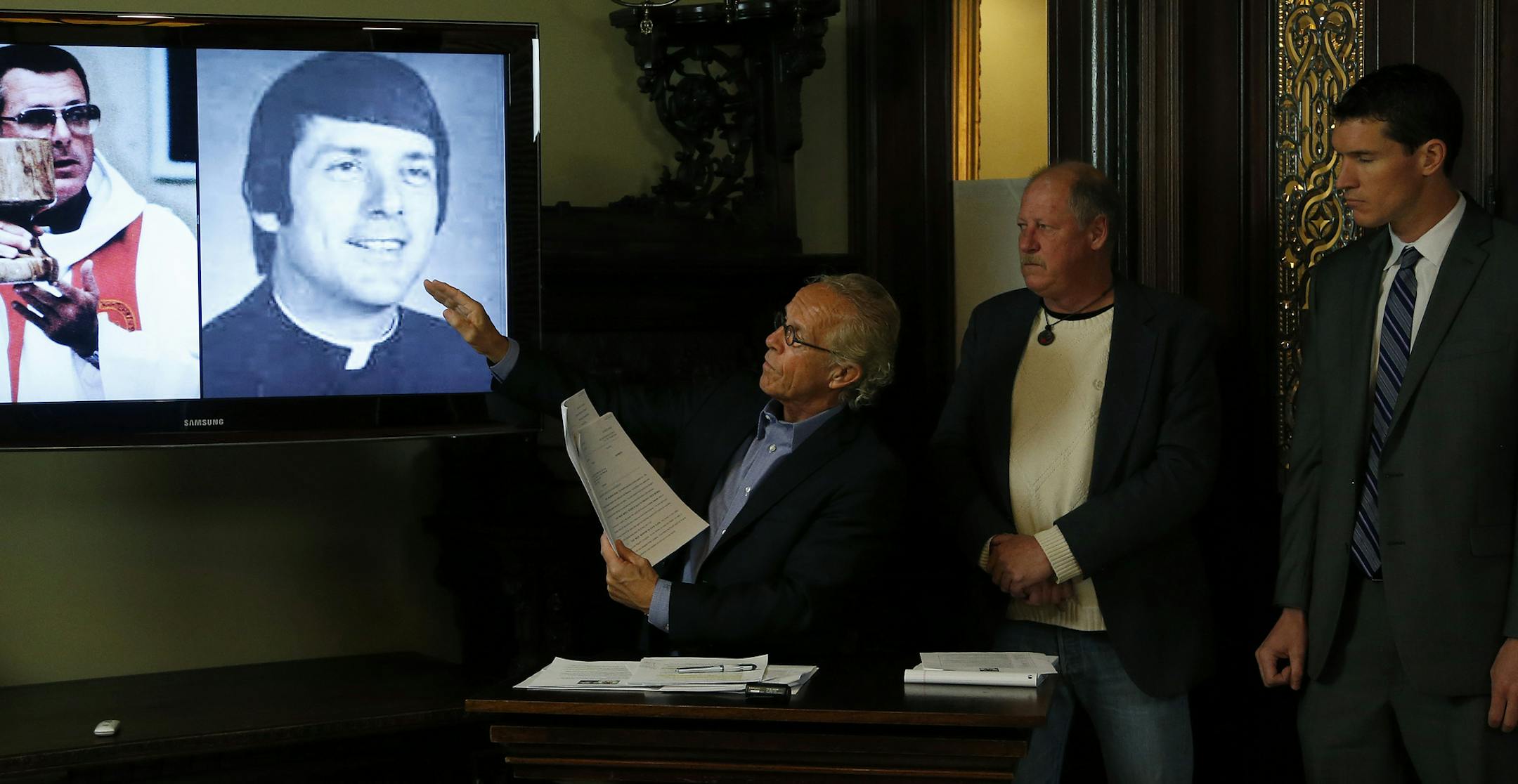 Attorneys Jeff Anderson (left) and Mike Finnegan (right) along with victim David Bidney (middle) during a press conference in St. Paul on Thursday. ] CARLOS GONZALEZ cgonzalez@startribune.com - November 20, 2014, St. Paul, Minn., Attorneys Jeff Anderson and Mike Finnegan announce the filings of two civil lawsuits against Gerald Funcheon, a former priest with the Crosier order, and also the Crosiers, for Funcheon's alleged sexual abuse of nearly 50 minors while working in churches in Minnesota an