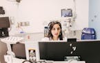 Dr. Meeta Shah, an emergency room doctor, took video calls at Rush University Medical Center, which is using telemedicine to screen and treat patients