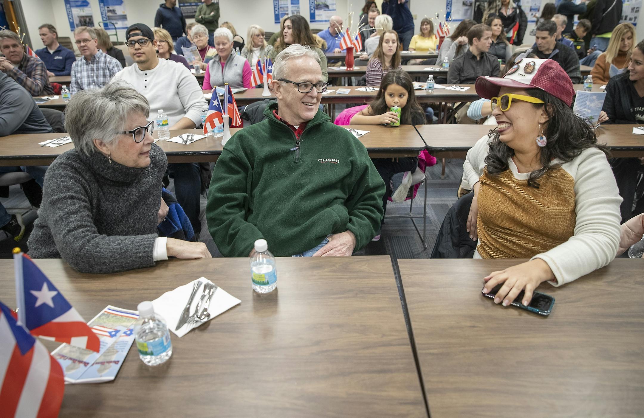 Michael and Mary Dieter sat next to their neighbor Karen Lopez Rivera, during a community welcome party and open house that Polaris hosted for families from Puerto Rico and the community at the Polaris manufacturing plant, Monday, February 17, 2020 in Roseau, MN.