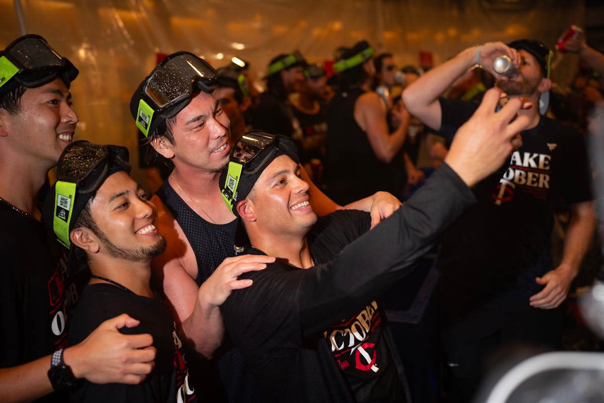 Twins pitcher Kenta Maeda, second from right, was in on a selfie as the team celebrated its victory over Toronto on Wednesday.