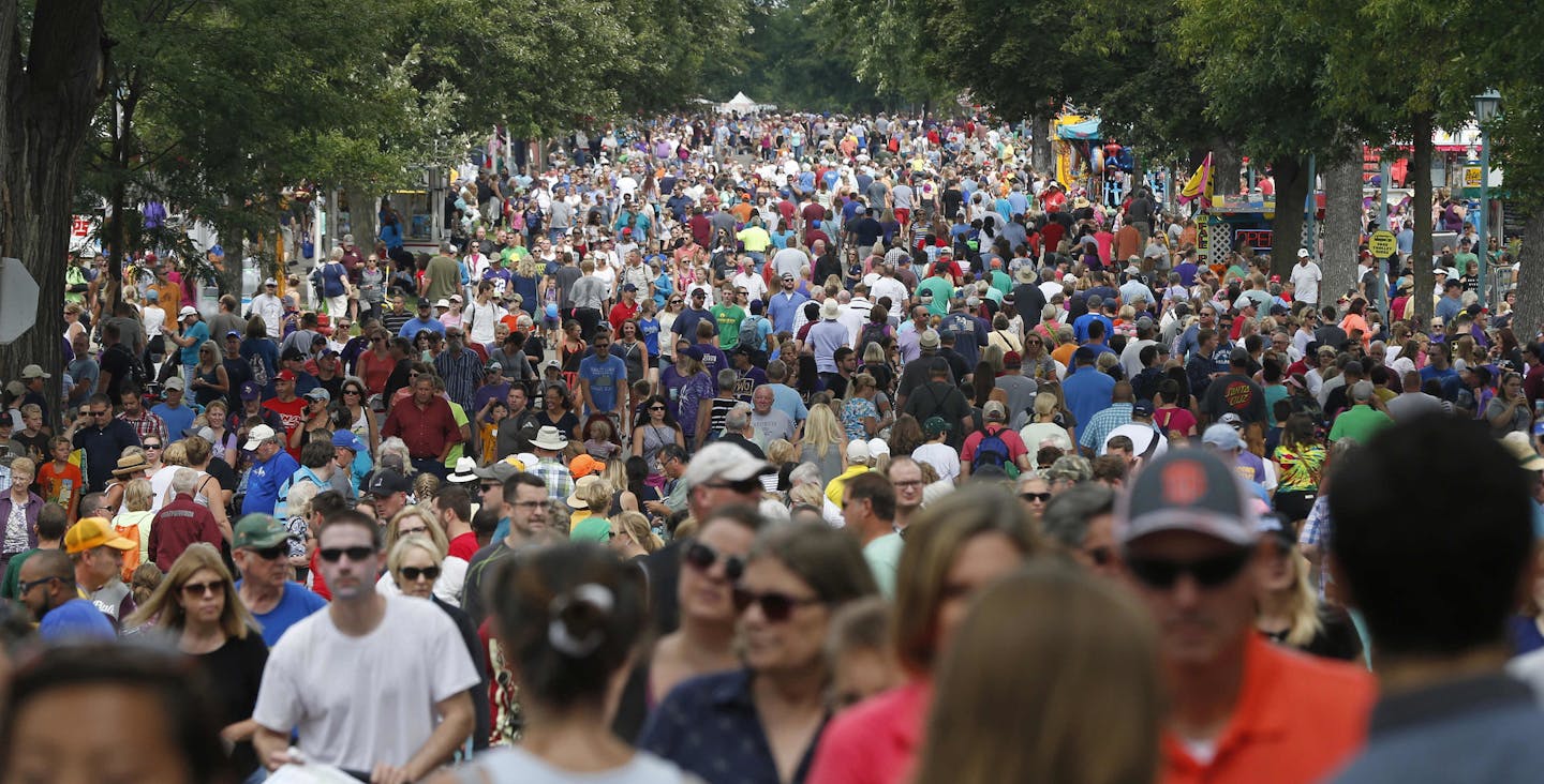 Thousands packed the Minnesota State Fair Friday, Aug. 26, 2016, in Falcon Heights, Minn. (AP Photo/Jim Mone)