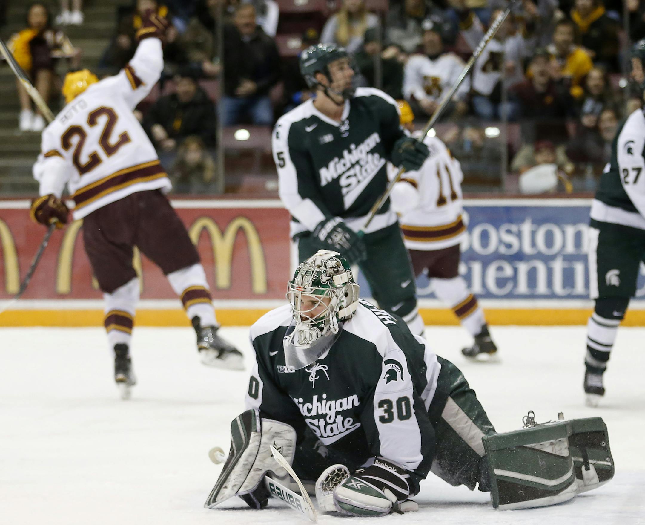 Travis Boyd (22) celebrated after shooting the puck past Michigan State goalie Jake Hildebrand (30) for a goal in the first period. ] CARLOS GONZALEZ cgonzalez@startribune.com, February 26, 2015, Minneapolis, MN, Minneapolis, MN, Mariucci Arena, NCAA Hockey, Big 10, University of Minnesota Gophers vs. Michigan State Spartans ORG XMIT: MIN1502262243264961