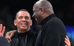 Magic Johnson, right, greeted Alex Rodriguez during a Lakers-Hornets game in 2018.