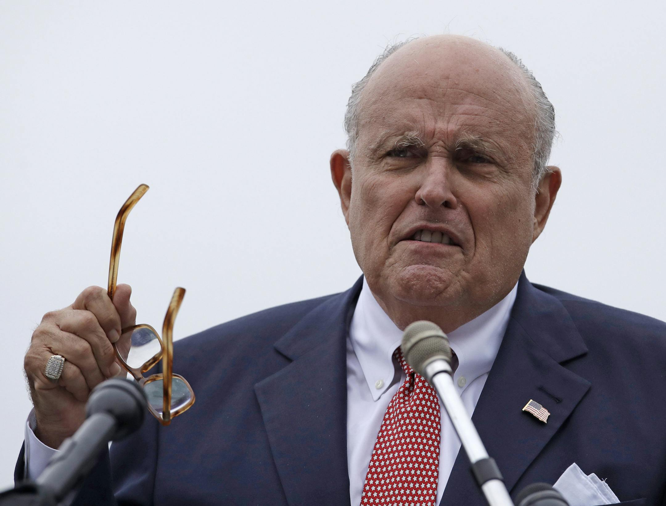 FILE - In this Aug. 1, 2018, file photo, Rudy Giuliani, an attorney for President Donald Trump, speaks in Portsmouth, N.H. President Donald Trump on Saturday, Oct. 12, 2019, stood behind personal attorney Giuliani, one of his highest-profile and most vocal defenders, amid reports that federal prosecutors in the city Giuliani led as mayor are eyeing him for possible lobbying violations. (AP Photo/Charles Krupa, File)