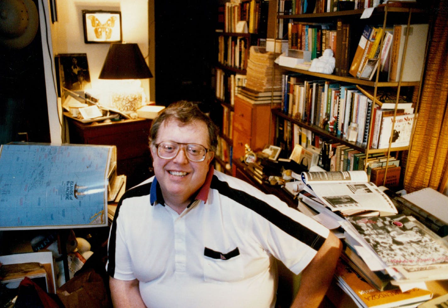 June 19, 1992 Jean-Nickolaus Tretter, gay historian, amidst books etc in his St Paul home, preparing Tretters' Hosyory Pavilion - a 100 ft long tent for the Lesibian-Gay Pride celebration at Loring Park. June 25, 1992 Jean-Nickolaus Tretter, shown at his home in St. Paul, prepared a History Pavilion for the Lesbian-Gay Pride Festival. Jean-Nickolaus Tretter is a modest, bookish fellow who is "socially naive," as he puts it. He's the kind of guy you mistake for a lamp at parties - not a swinger. Yet when the 20th annual Lesbian-Gay Pride Festival gets underway Saturday and Sunday in Loring Park, Tretter will be thrust center stage. If he is not the life of that party - and itÕs expected to be a big one with more than 30,000 participants - his contribution will be hard to miss. TretterÕs History Pavilion, wrapped inside a 100-foot tent, will loom over the park this weekend. So auspicious is its presence that such dignitaries as Sen. Paul Well-stone, Minneapolis City Council President Sharon Sayles Belton and St. Paul City Council President Bill Wilson will be on hand for a 1:30 p.m. ribbon-cutting ceremony Saturday. The exhibit is the first of its kind at the Pride Festival, with displays covering, as Tretter put it, "4,000 years of gay and lesbian history." Five sections will focus on African, Asian and American Indian cultures, ancient civilizations and Western civilization up to the present, including a special section on Minnesota. The visits of Gertrude Stein to Minnesota in 1934 and of Oscar Wilde to St. Paul are documented with photographs, documents and letters. (The frame of WildeÕs photograph is a reproduction of the patterned velvet suit he wore.) Tom Sweeney, Minneapolis Star Tribune