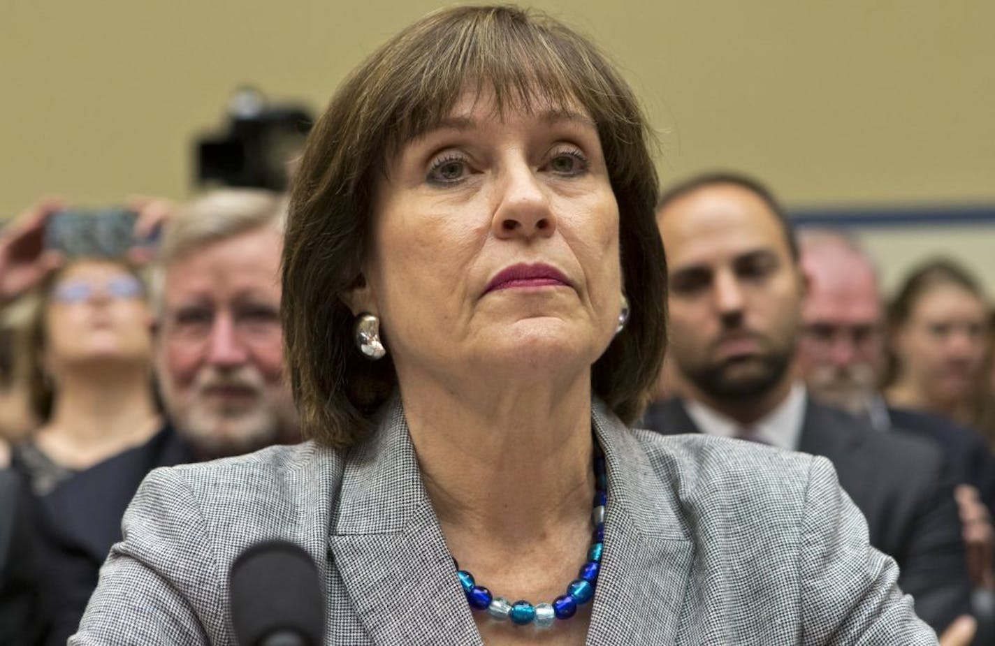 Lois Lerner, head of the IRS unit that decides whether to grant tax-exempt status to groups, listens on Capitol Hill Wednesday at the start of a House Oversight and Government Reform Committee hearing to investigate the extra scrutiny the IRS gave to Tea Party and other conservative groups that applied for tax-exempt status.