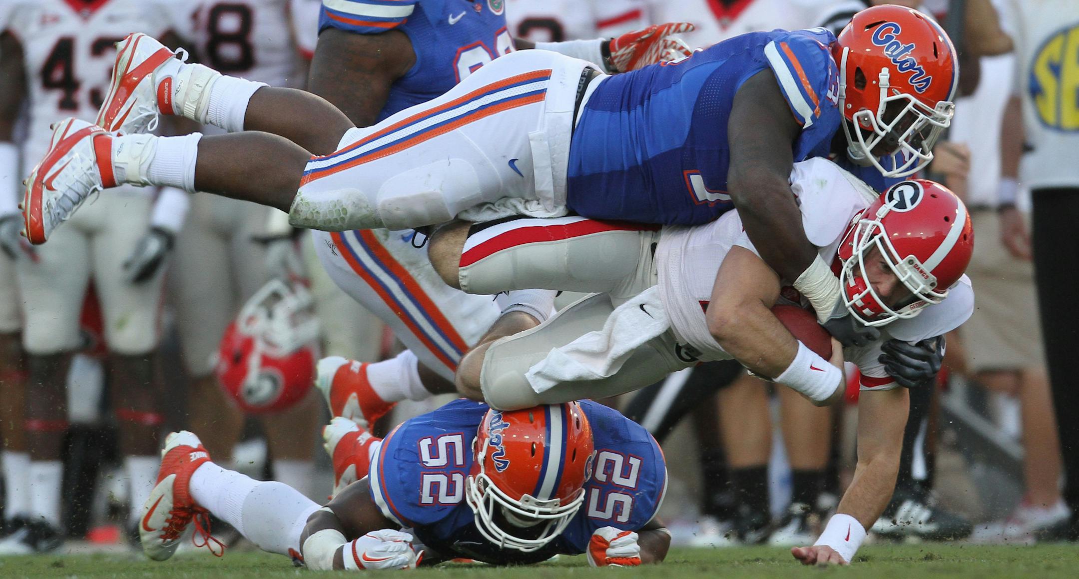 Florida defensive tackle Sharrif Floyd (73) tackles Georgia quarterback Aaron Murray (11) during the Gators 24-20 loss to the Bulldogs at EverBank Field in Jacksonville, Florida, on Saturday, October 29, 2011. (Gary W. Green/Orlando Sentinel/MCT) ORG XMIT: 1113369