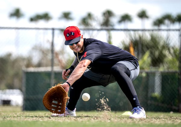 Jose Miranda scoops a ball during a February practice at Hammond Stadium in Fort Myers, Fla.