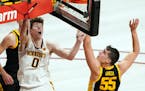 Minnesota center Liam Robbins (0) went up for a shot over Iowa center Luka Garza (55) in the second half. ] ANTHONY SOUFFLE • anthony.souffle@startr