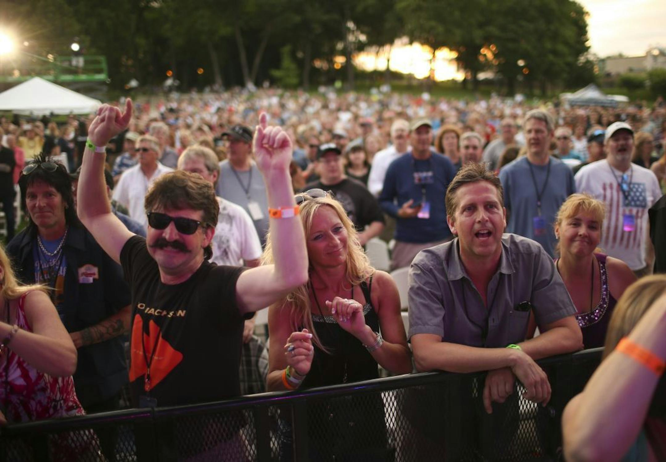 Fans in the front row listened to Cheap Trick early in their set Thursday night.