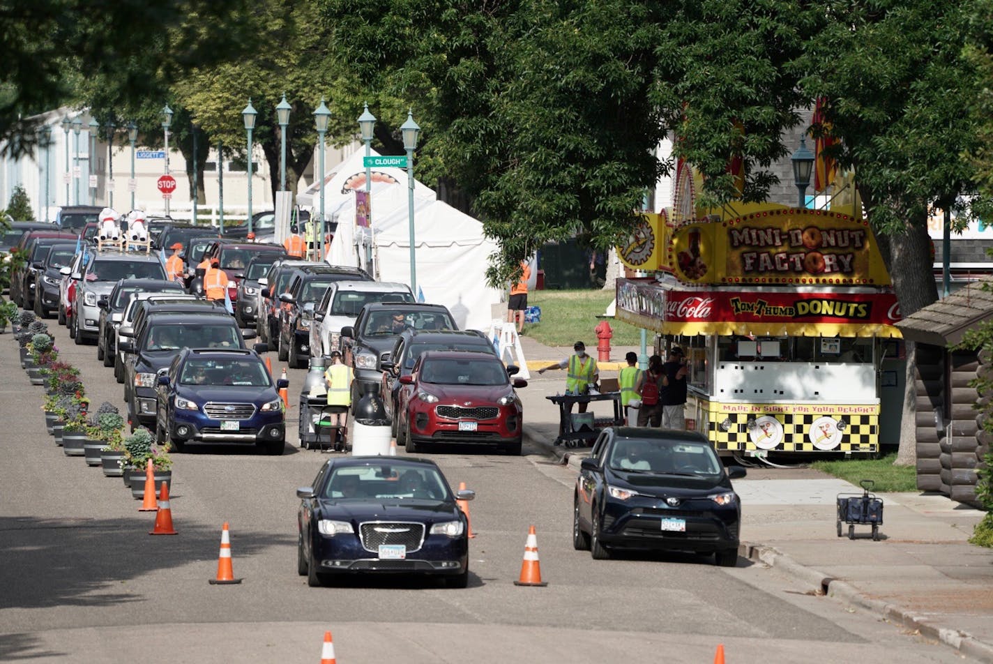 There was a line of cars early Thursday for the first-ever Minnesota State Fair food parade which gives vehicles drive-through access to 16 fair food vendors in a multi-hour parade through the fairgrounds.