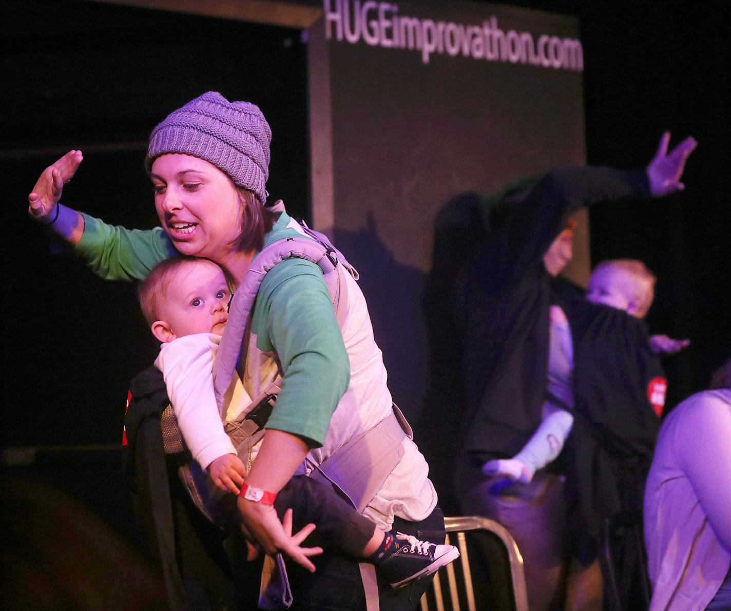 As part of Give to the Max Day, HUGE Improv Theater in Minneapolis hosted 28 continuous hours of improv starting Wednesday and seen Thursday, Nov. 14, 2019, in Minneapolis, MN. Here, improvisers with Resist Sleep, including Becky Hauser, left, and Shea Roberts, and their children, during their 20-minute improv.