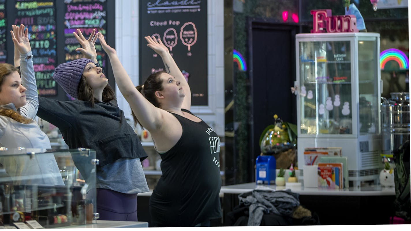 Yoga students from left, Haley, Maria, and Mary, (Did not want to give their last names) took a class in the middle of Keg and Case before they opened their doors, Saturday, February 8, 2020 in St. Paul, MN. ] ELIZABETH FLORES &#x2022; liz.flores@startribune.com