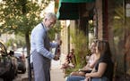 Tilia owner Steven Joel Brown serves wine to customers Claire Fechter, from right, and Chelsey Ireland.