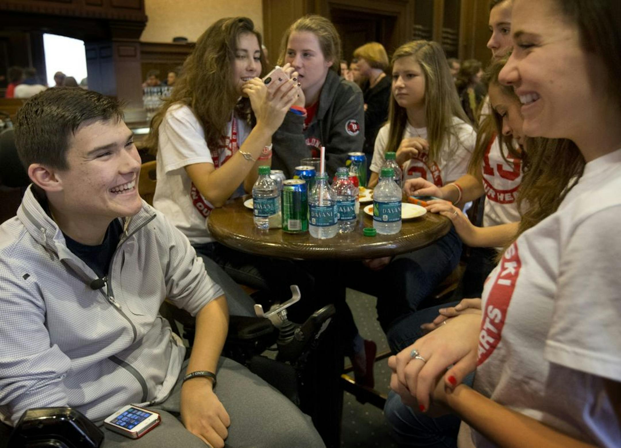 Jack Jablonski joked with friend Katie Oppenheimer, 17, at a TV-viewing party held in his honor Sunday in St. Paul.