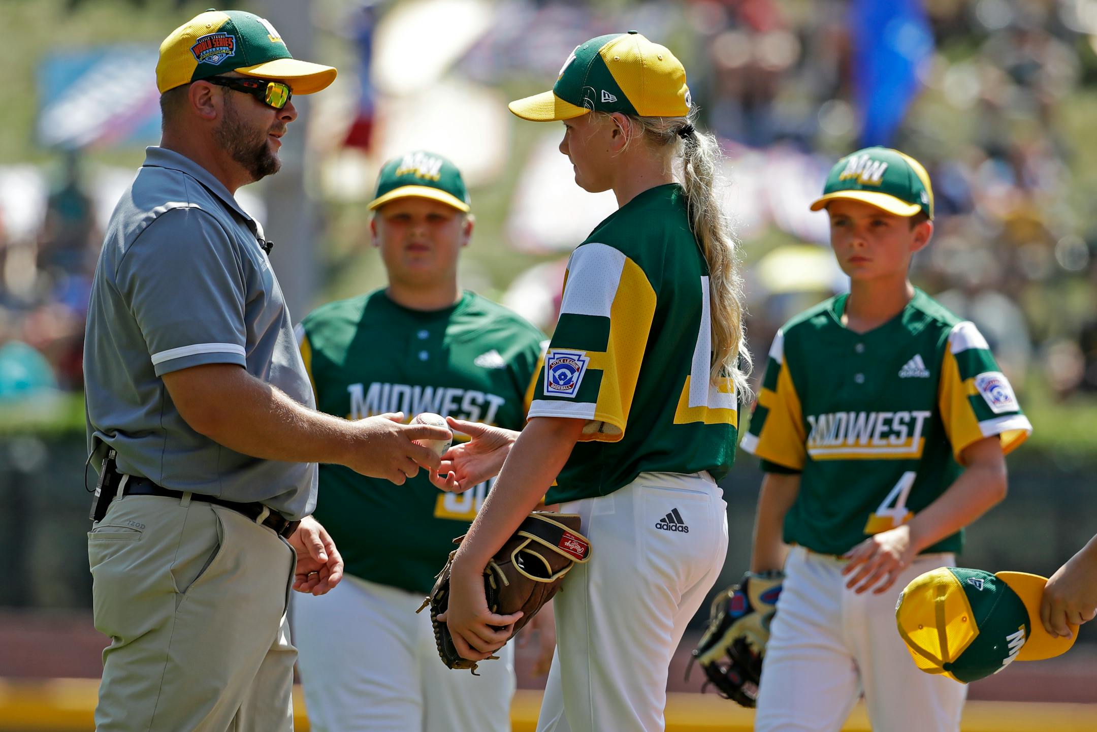 Coon Rapids-Andover manager Greg Bloom took the ball from pitcher Maddy Freking during the third inning against South Riding, Va., at the Little League World Series tournament in South Williamsport, Pa., on Sunday. Virginia won 11-0 on Justin Lee's no-hitter.