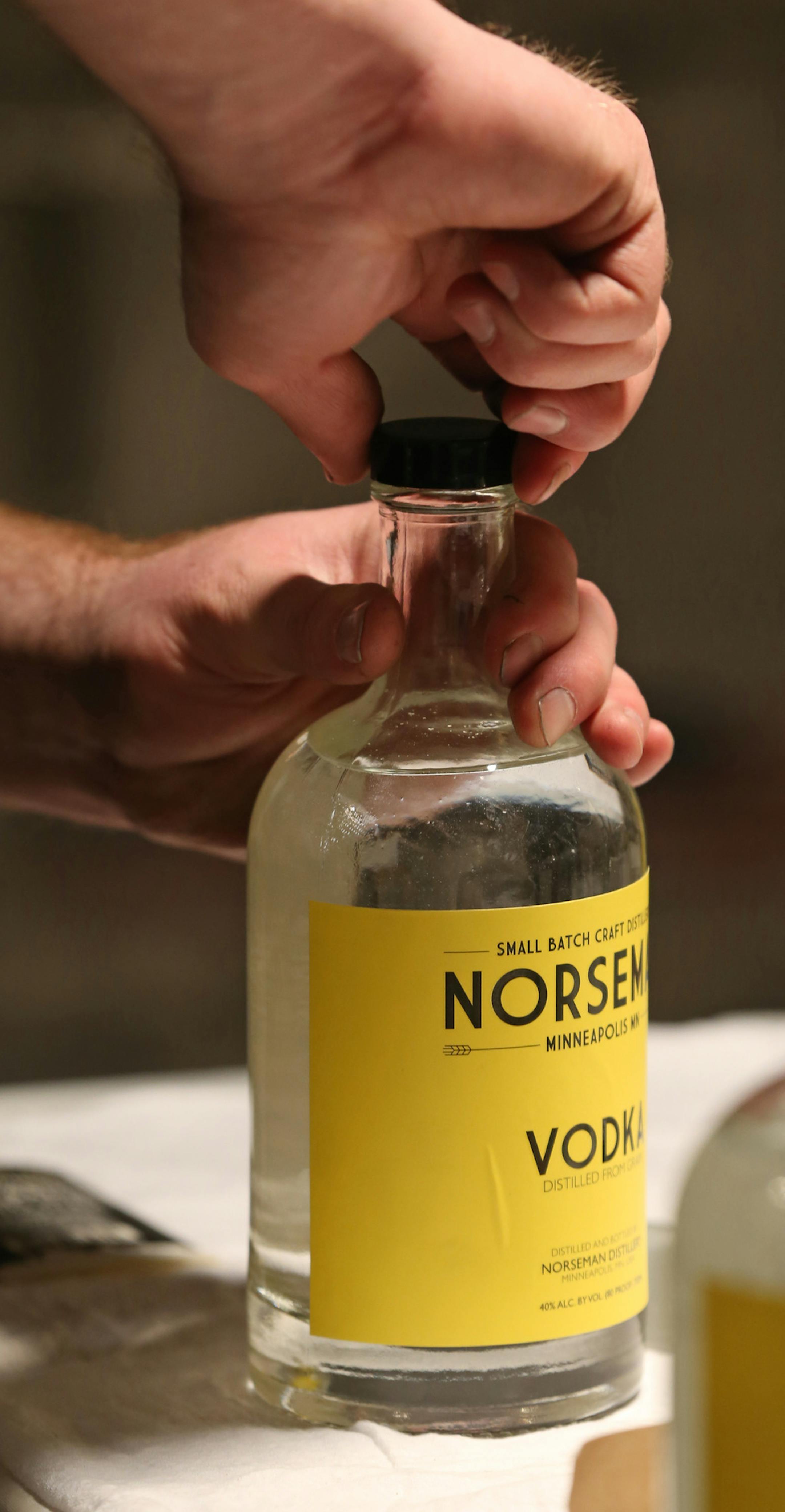 Scott Ervin closed bottles after filling with Norseman Vodka on 1/10/14. The year starts off with a high-proof bang, as micro-distillers open in the metro. One of the first to actually have product in stores and bars is the small Norseman Distillery in NE Mpls., run by Scott Ervin.] Bruce Bisping/Star Tribune bbisping@startribune.com Scott Ervin/source.