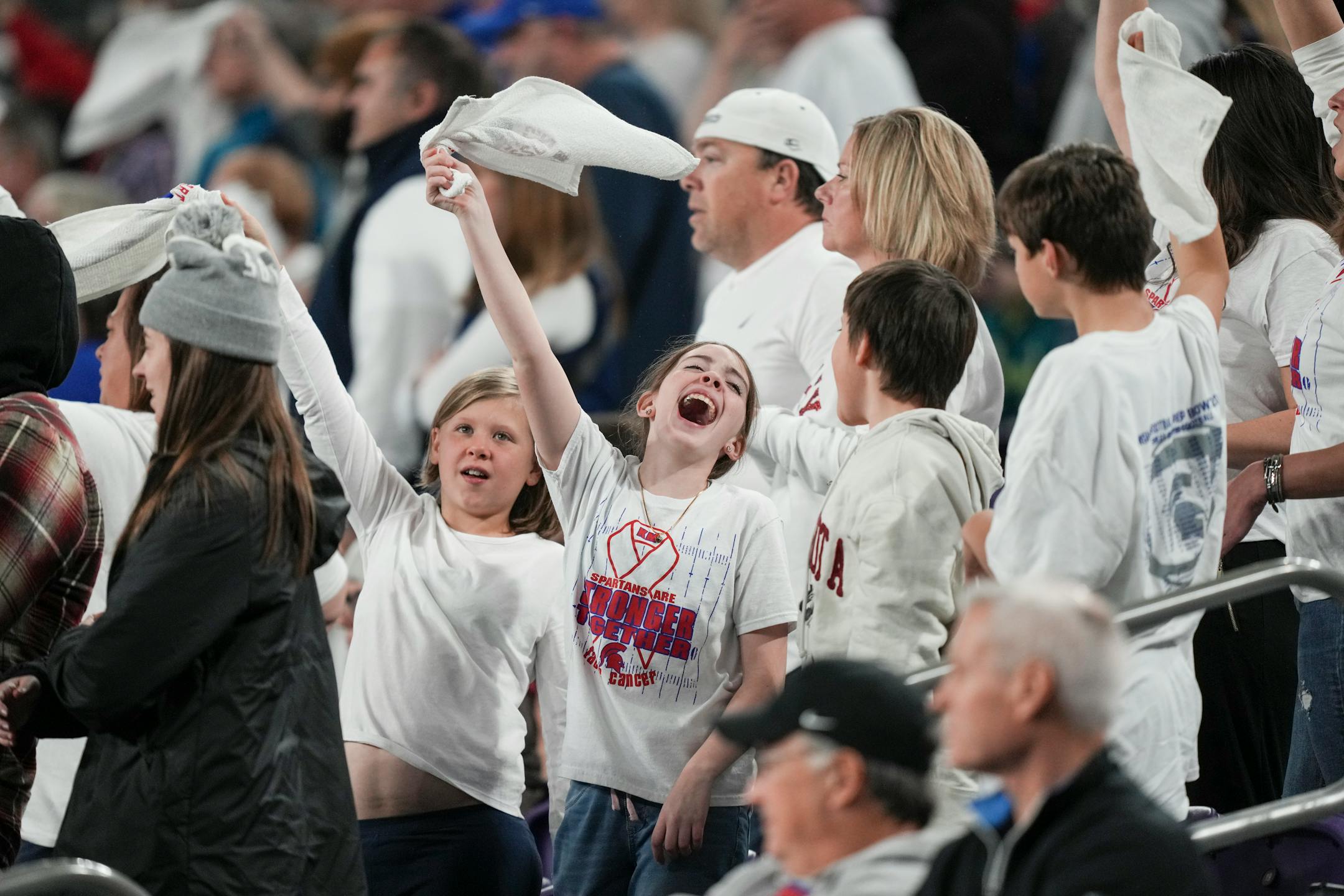Simley Spartans fans cheer in the stands in the second half.