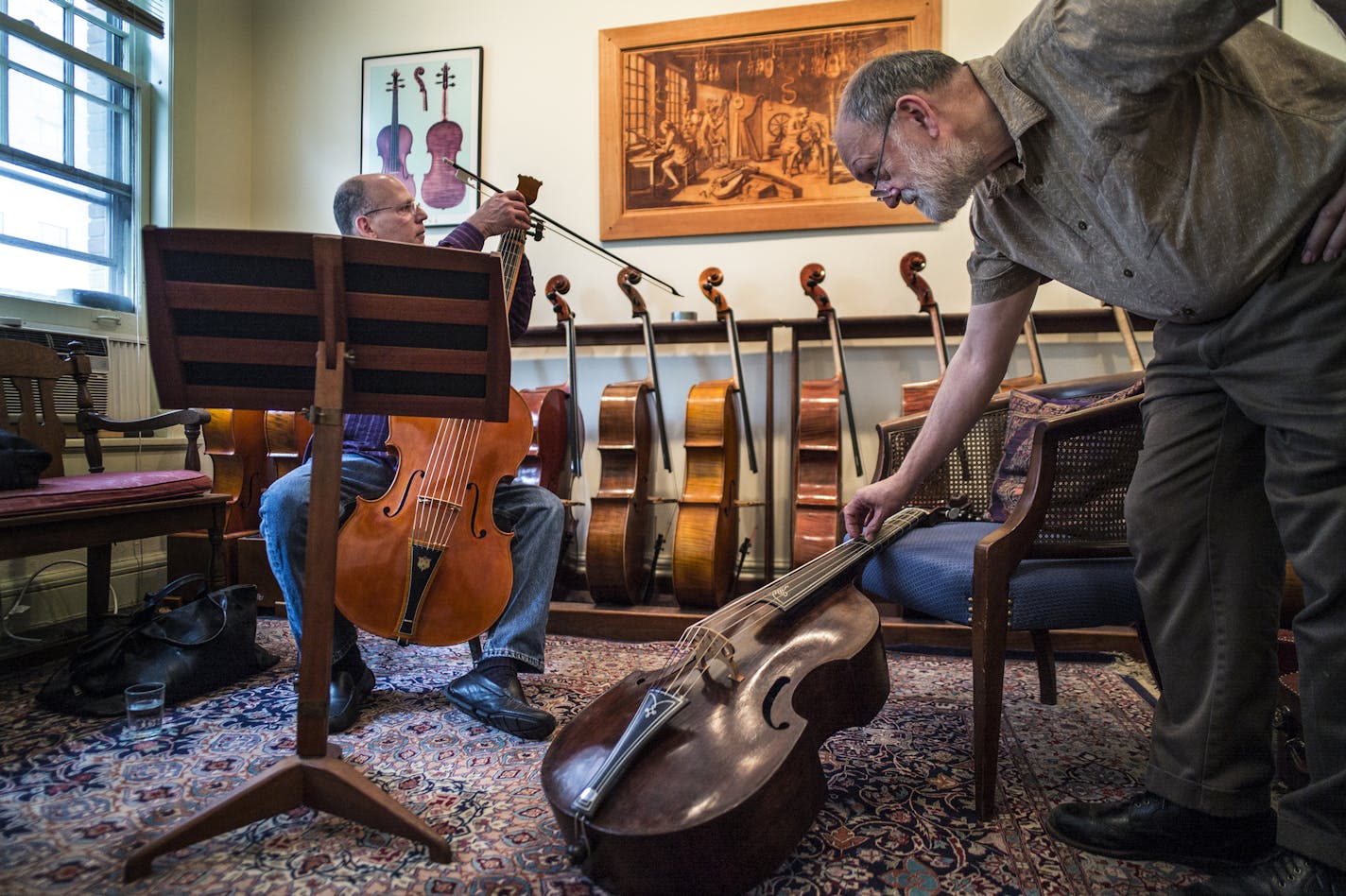 At Givens Violins, Mark Kramer of Ars Antigua tried out a French Baroque solo bass viol which has seven strings while Andrew Dipman used the 1713 Schimd viol da gamba that he spent the last 2.5 years restoring to help tune it. Kramer is from New York and flew in to pick up the rare instrument on the right. ]Richard tsong-taatarii/rtsong-taatarii@startribune.com